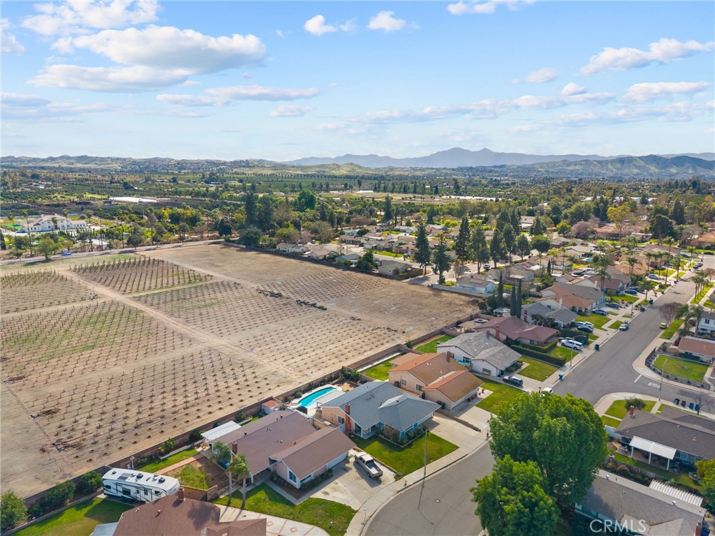 8548 Turlock Drive Riverside, CA 92504 - Photo 47 of 56 an aerial view of residential building with swimming pool and ocean view
