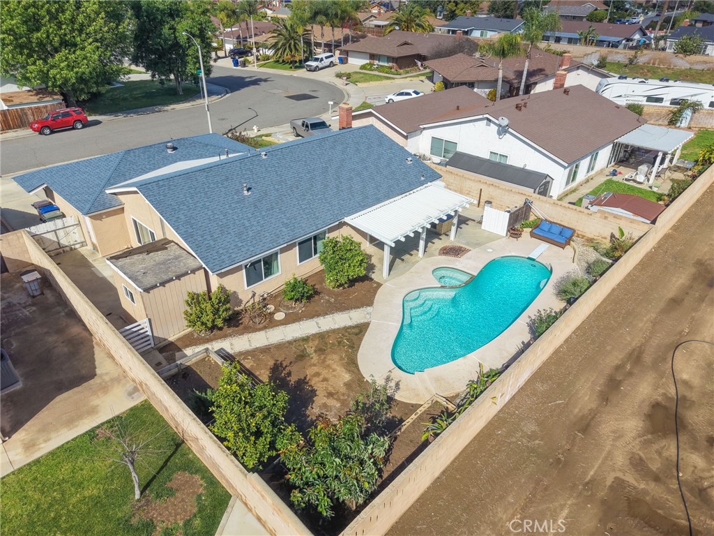 8548 Turlock Drive Riverside, CA 92504 - Photo 50 of 56 an aerial view of a house with a swimming pool yard and outdoor seating
