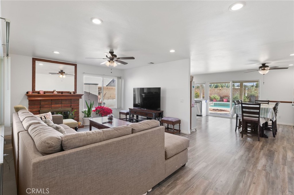 8548 Turlock Drive Riverside, CA 92504 - Photo 8 of 56 a living room with furniture and a flat screen tv
