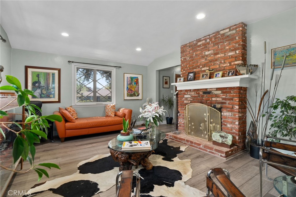 5180 Stonewood Drive Riverside, CA 92506 - Photo 11 of 49 a living room with furniture and a fireplace