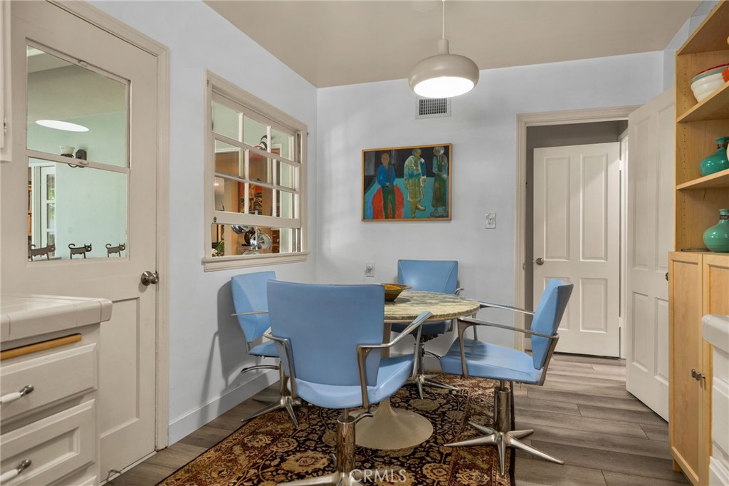 5180 Stonewood Drive Riverside, CA 92506 - Photo 18 of 49 a view of a dining room with furniture window and wooden floor