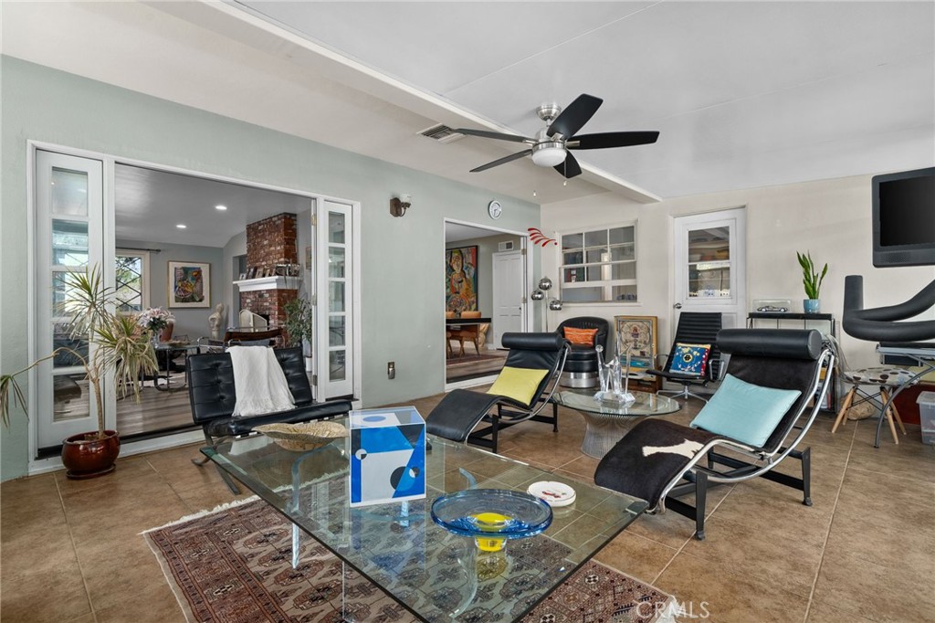 5180 Stonewood Drive Riverside, CA 92506 - Photo 20 of 49 a living room with furniture a wooden floor and a window