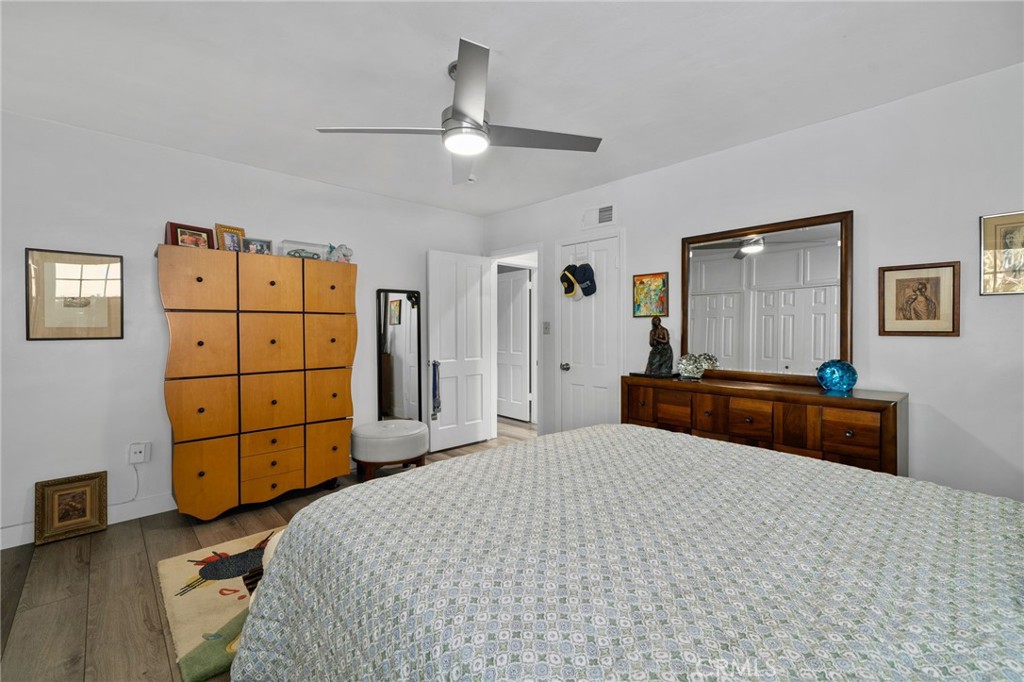5180 Stonewood Drive Riverside, CA 92506 - Photo 25 of 49 a bedroom with a bed and a dresser