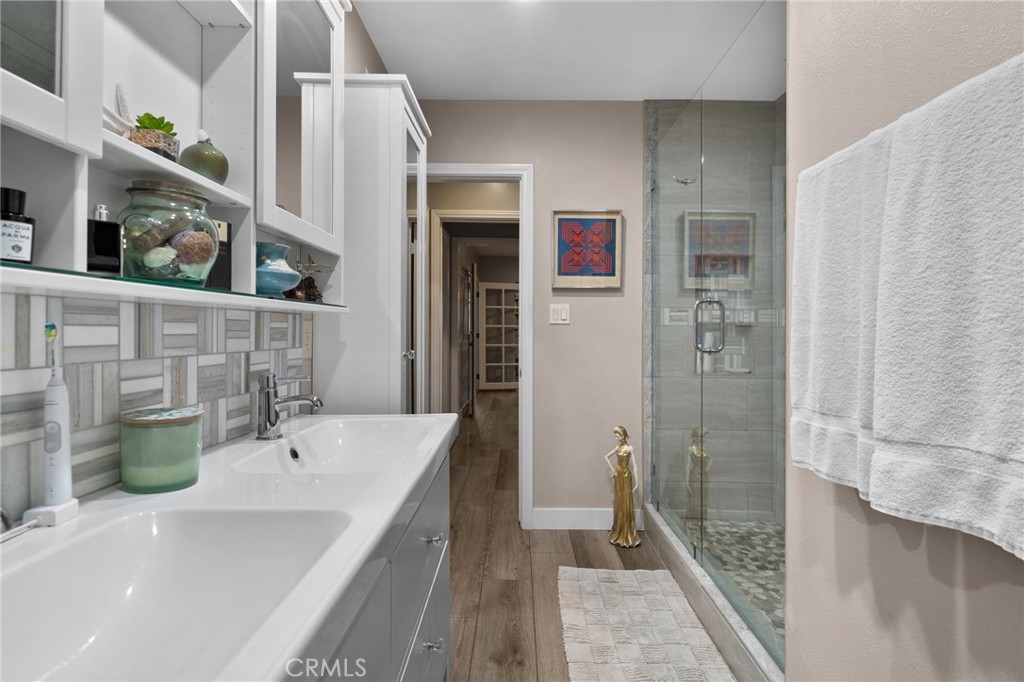 5180 Stonewood Drive Riverside, CA 92506 - Photo 28 of 49 a bathroom with a bathtub and a sink