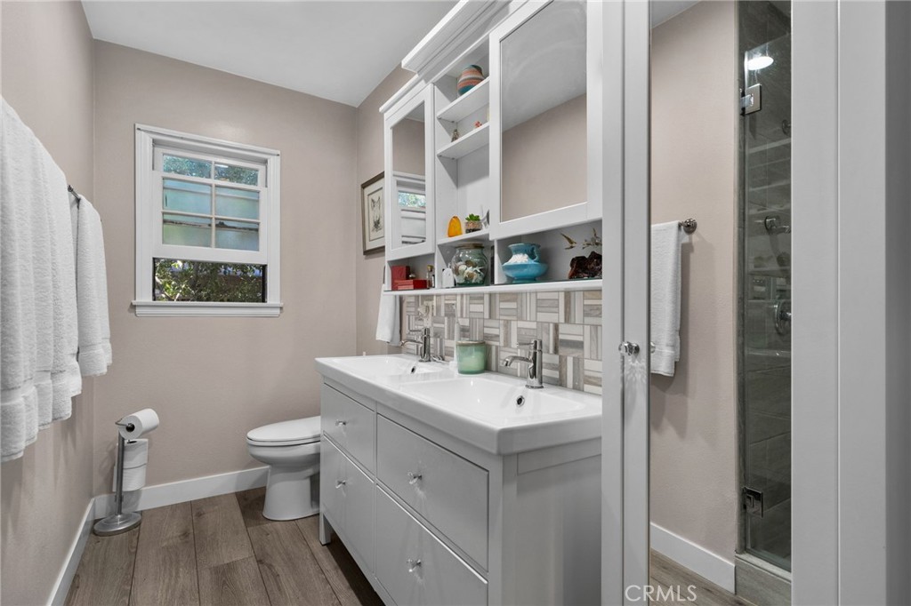 5180 Stonewood Drive Riverside, CA 92506 - Photo 31 of 49 a bathroom with a sink and a mirror