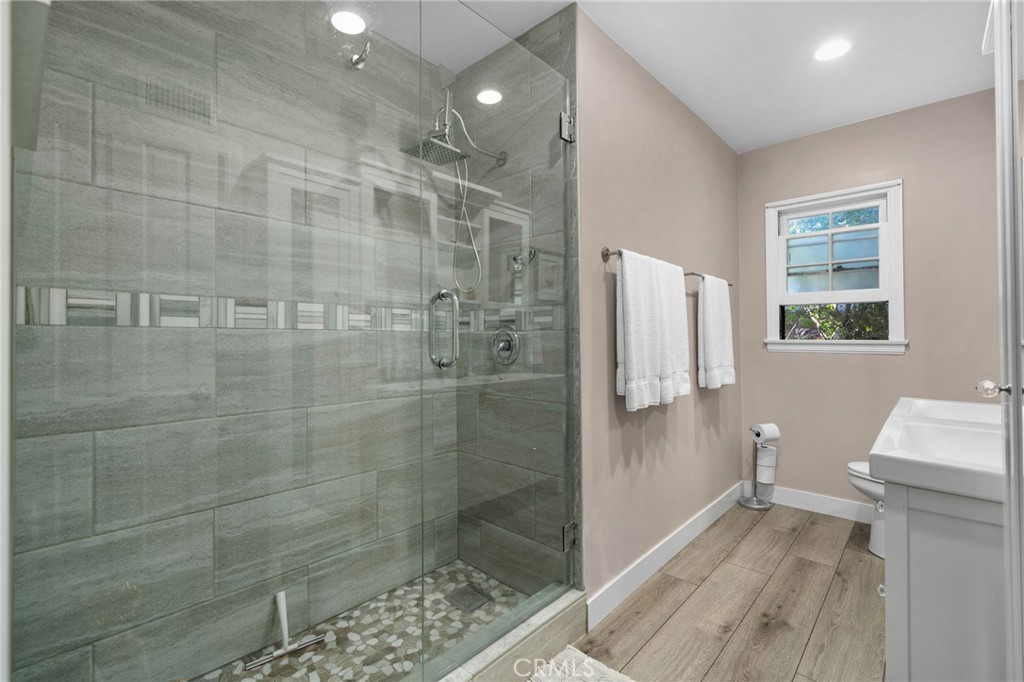 5180 Stonewood Drive Riverside, CA 92506 - Photo 32 of 49 a bathroom with a shower and a toilet