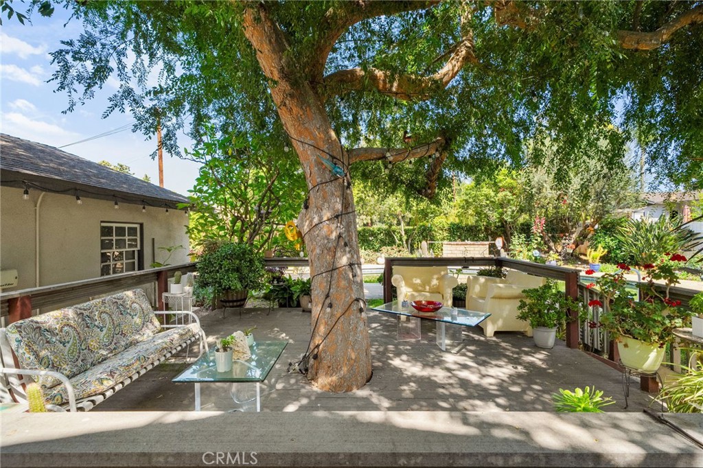5180 Stonewood Drive Riverside, CA 92506 - Photo 39 of 49 a view of a yard with plants and a bench