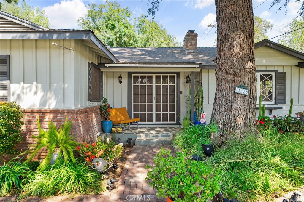 5180 Stonewood Drive Riverside, CA 92506 - Photo 4 of 49 a front view of a house with garden