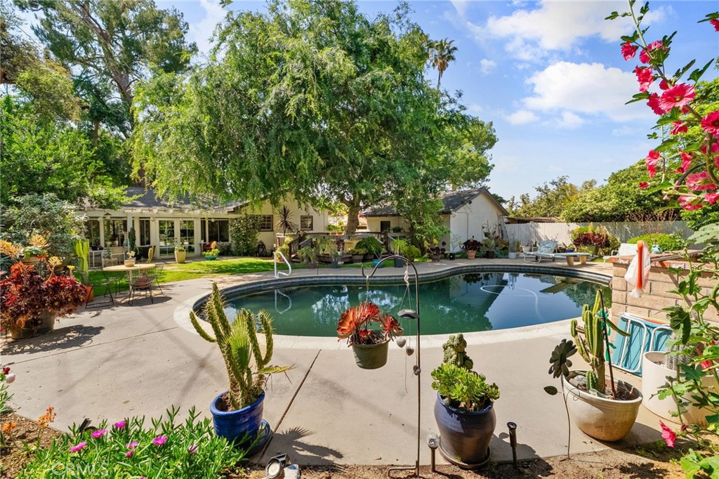 5180 Stonewood Drive Riverside, CA 92506 - Photo 44 of 49 a view of a swimming pool with furniture