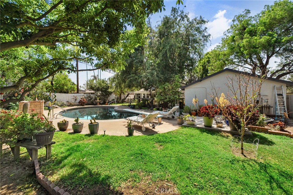 5180 Stonewood Drive Riverside, CA 92506 - Photo 45 of 49 a view of a house with a yard and sitting area