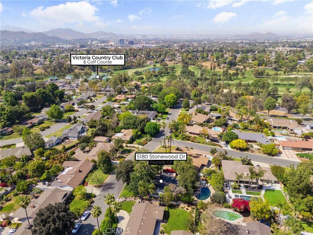 5180 Stonewood Drive Riverside, CA 92506 - Photo 47 of 49 an aerial view of residential building with green space
