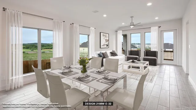 a living room with furniture and large windows