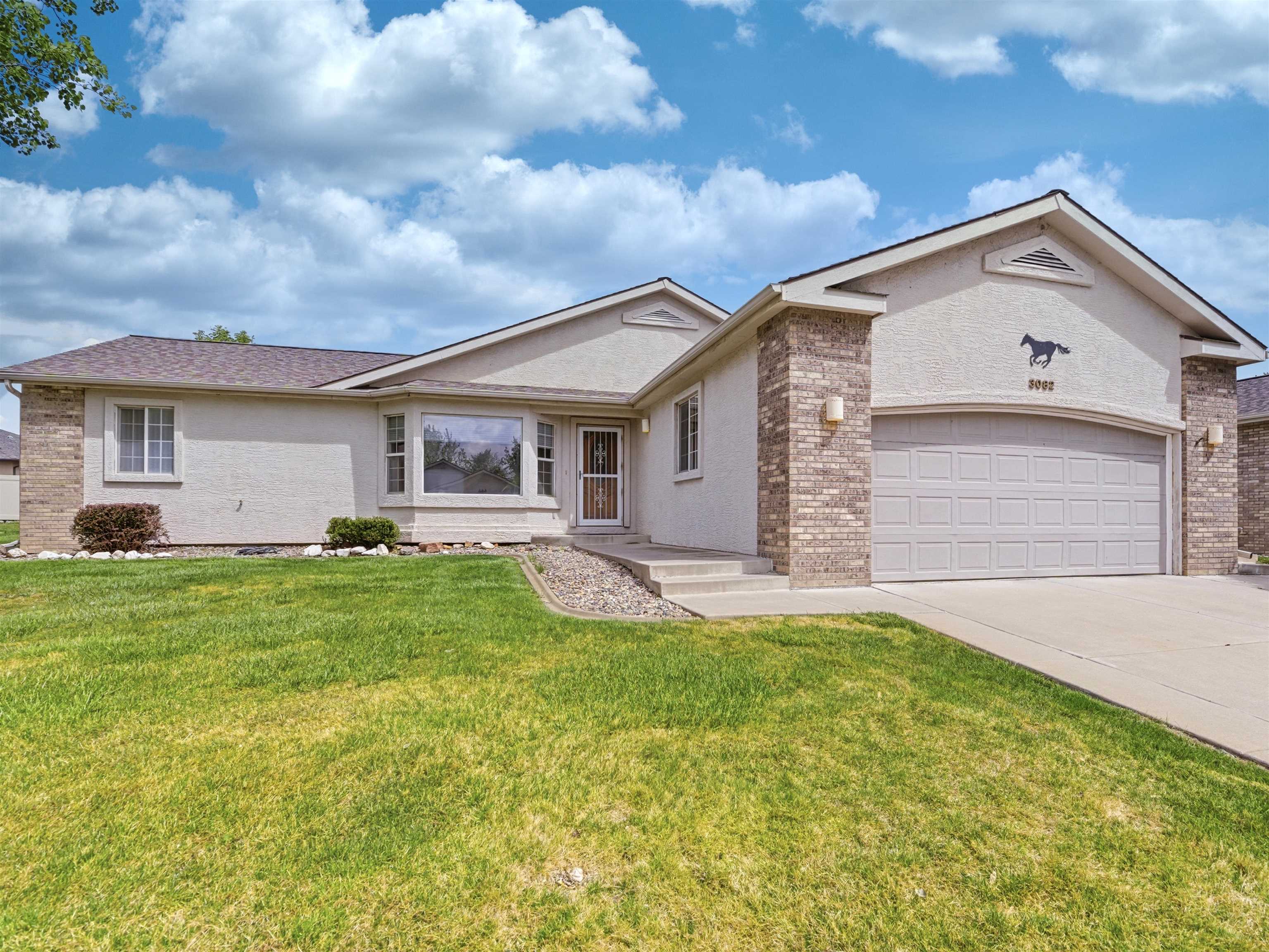 3082 Shadowbrook Court Grand Junction, CO 81504 - Photo 28 of 28 a view of an house with backyard space and garden