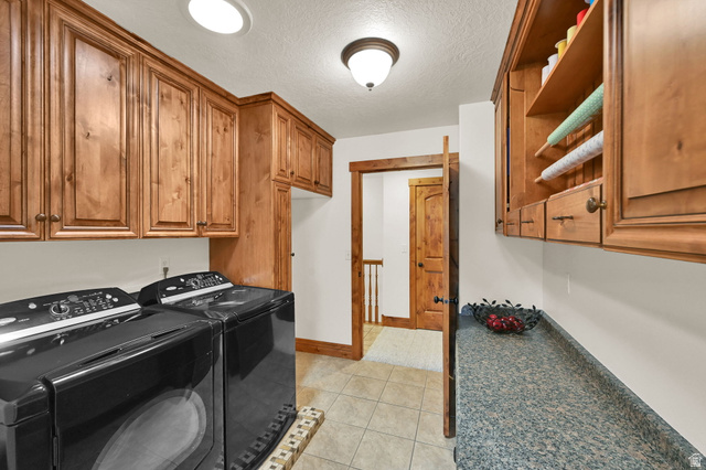 13658 South Fort Street Draper, UT 84020 - Photo 22 of 87 Dedicated laundry area featuring extensive wood cabinetry, a durable countertop, and tile flooring