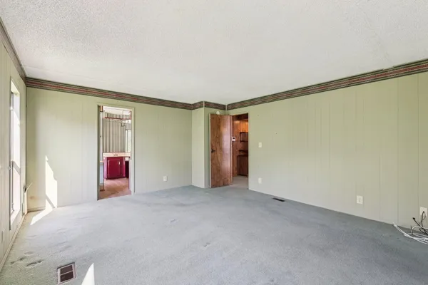a spacious bathroom with a sink toilet and shower