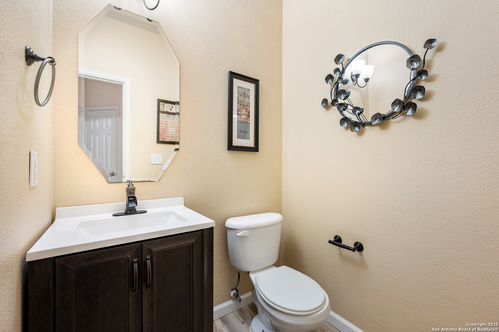 10414 Rainbow View Helotes, TX 78023 - Photo 18 of 38 a bathroom with a sink vanity mirror and toilet