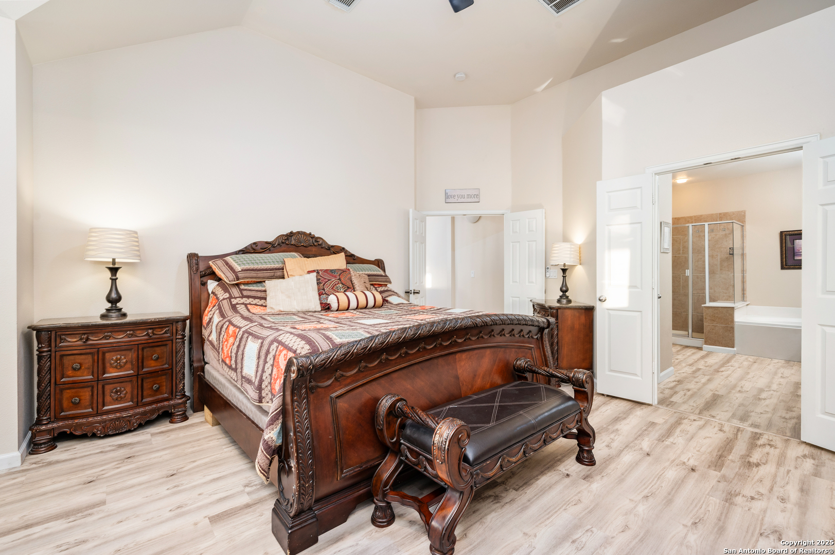 10414 Rainbow View Helotes, TX 78023 - Photo 20 of 38 a bedroom with a bed and wooden floor