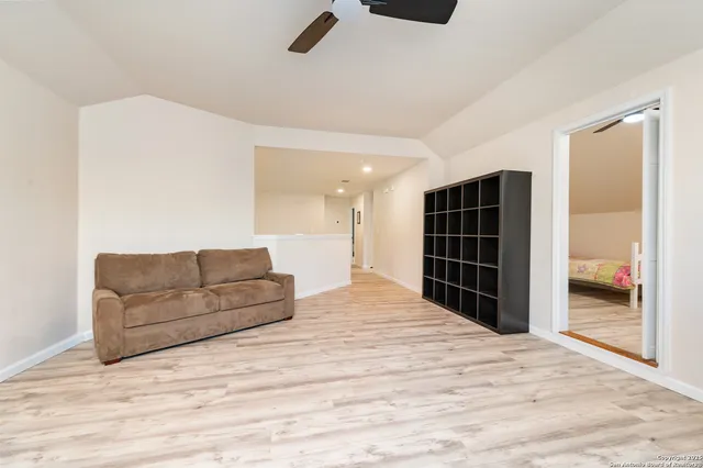 a living room with furniture and walk in closet