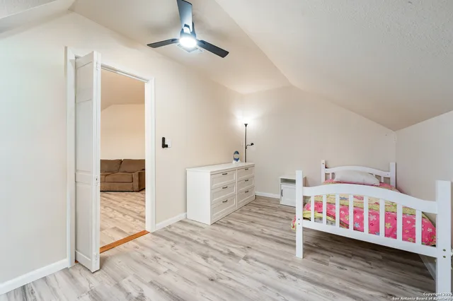 a bathroom with a sink a mirror and a shower