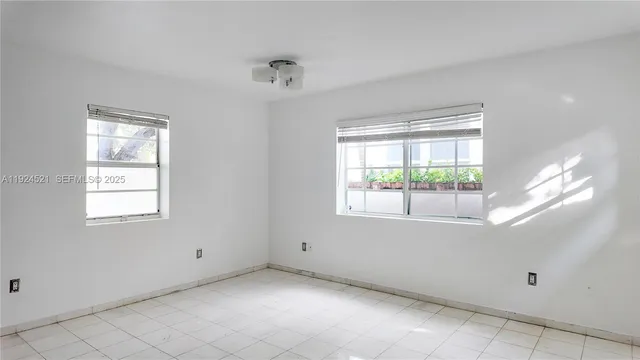 an empty room with windows