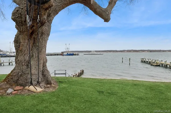 a view of a lake with a big yard
