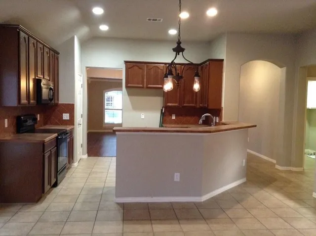 a view of a living room with furniture