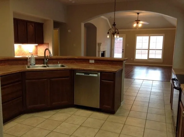 a kitchen with a sink and cabinets