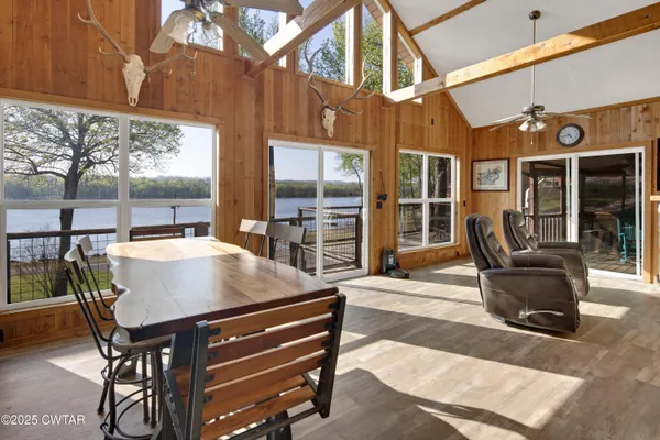 a view of a patio with table and chairs