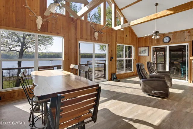 a view of a patio with table and chairs