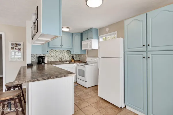 a kitchen with a refrigerator a sink and dishwasher