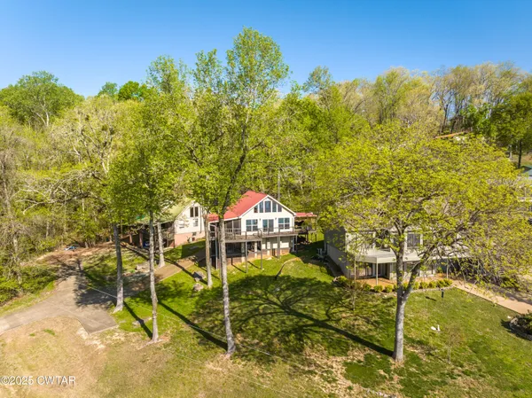 a view of a swimming pool with a yard