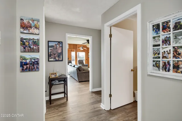 a view of a livingroom with furniture and workspace