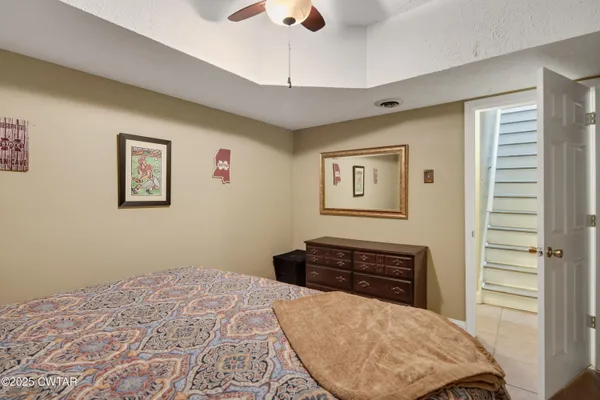 a bedroom with a bed and a dresser