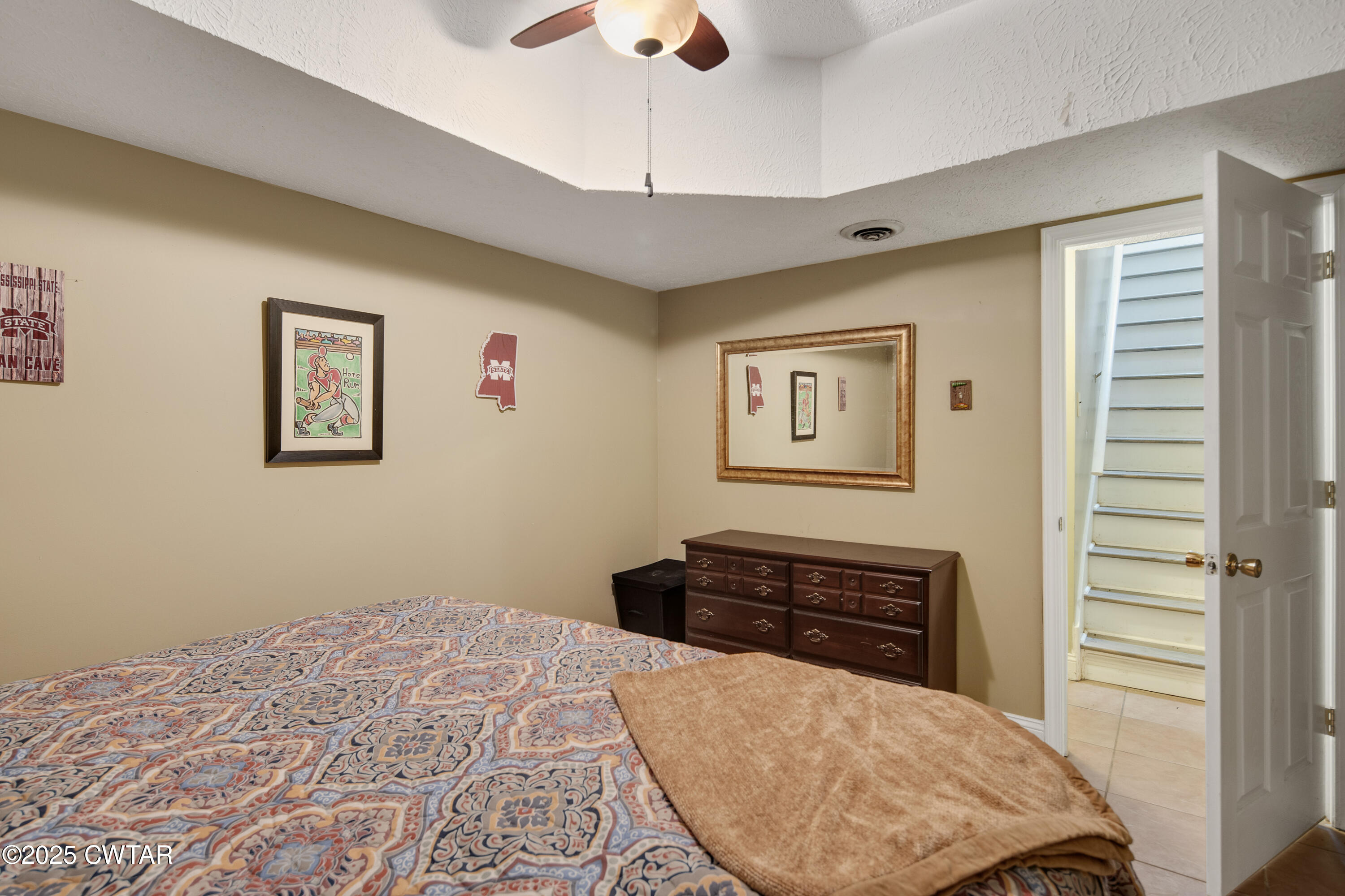 229 Bill Perry Drive Sugar Tree, TN 38380 - Photo 30 of 42 a bedroom with a bed and a dresser