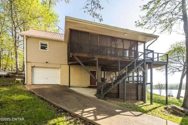 a view of a chairs and table in a patio