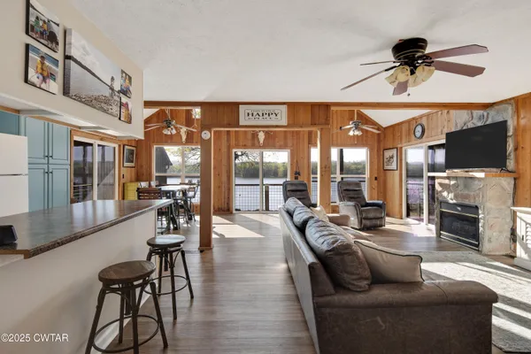 a living room with furniture and a fireplace