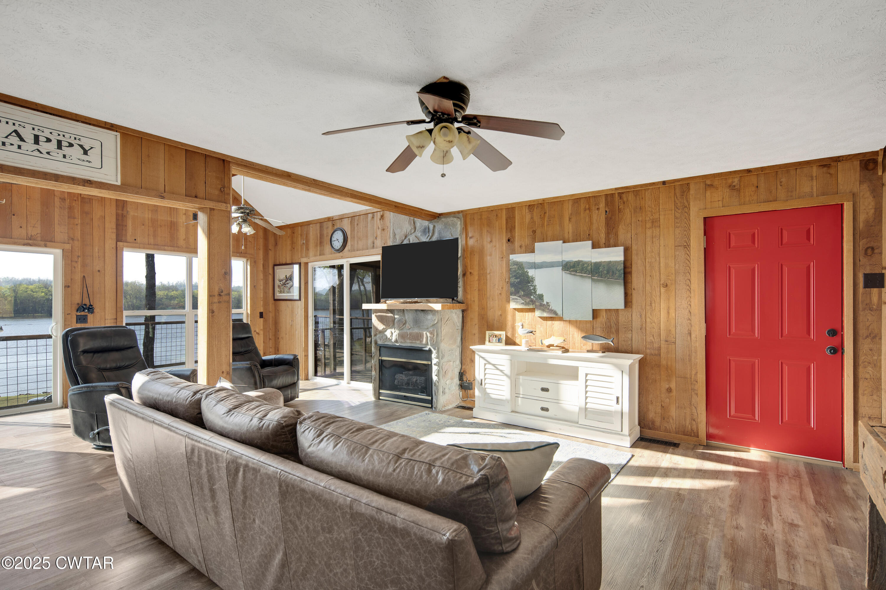 229 Bill Perry Drive Sugar Tree, TN 38380 - Photo 8 of 42 a living room with furniture and a chandelier