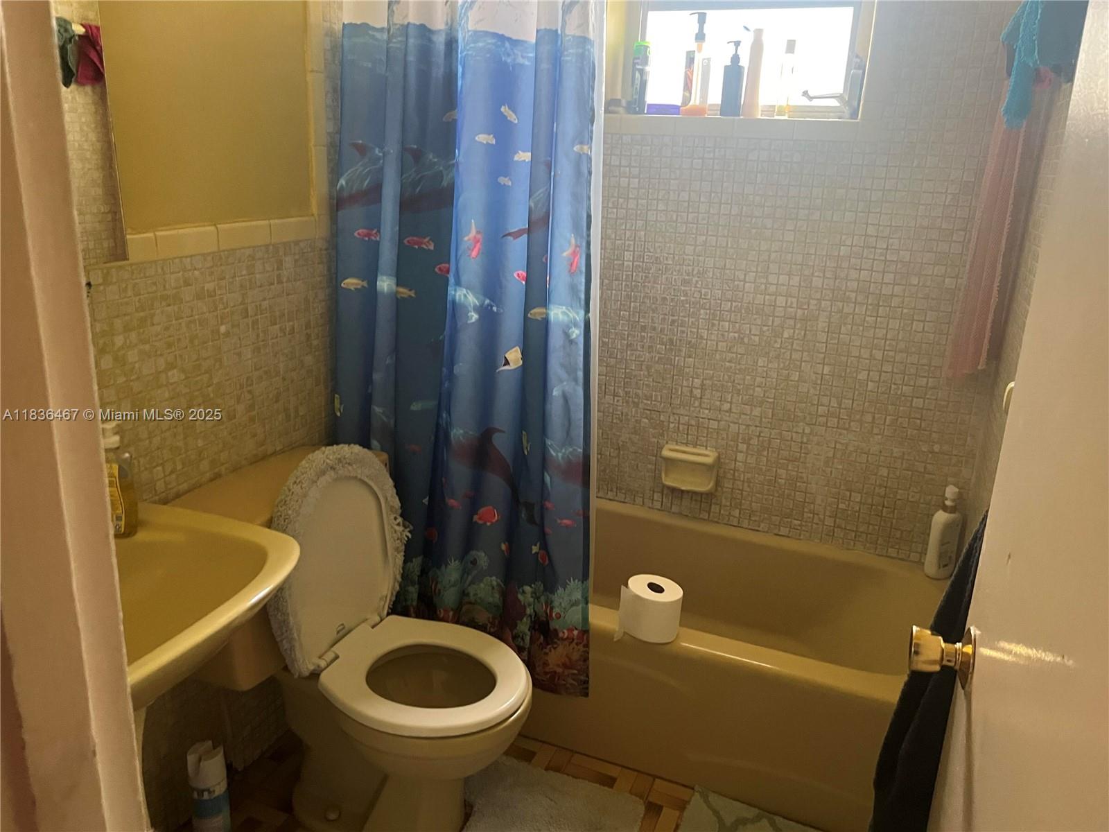 1825 Northwest 112th Street Miami, FL 33167 - Photo 18 of 24 a bathroom with a sink and bathtub