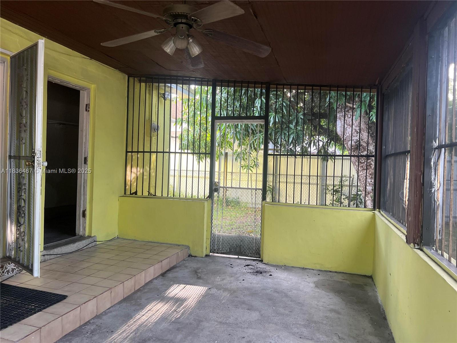 1825 Northwest 112th Street Miami, FL 33167 - Photo 19 of 24 a view of an empty room with a window