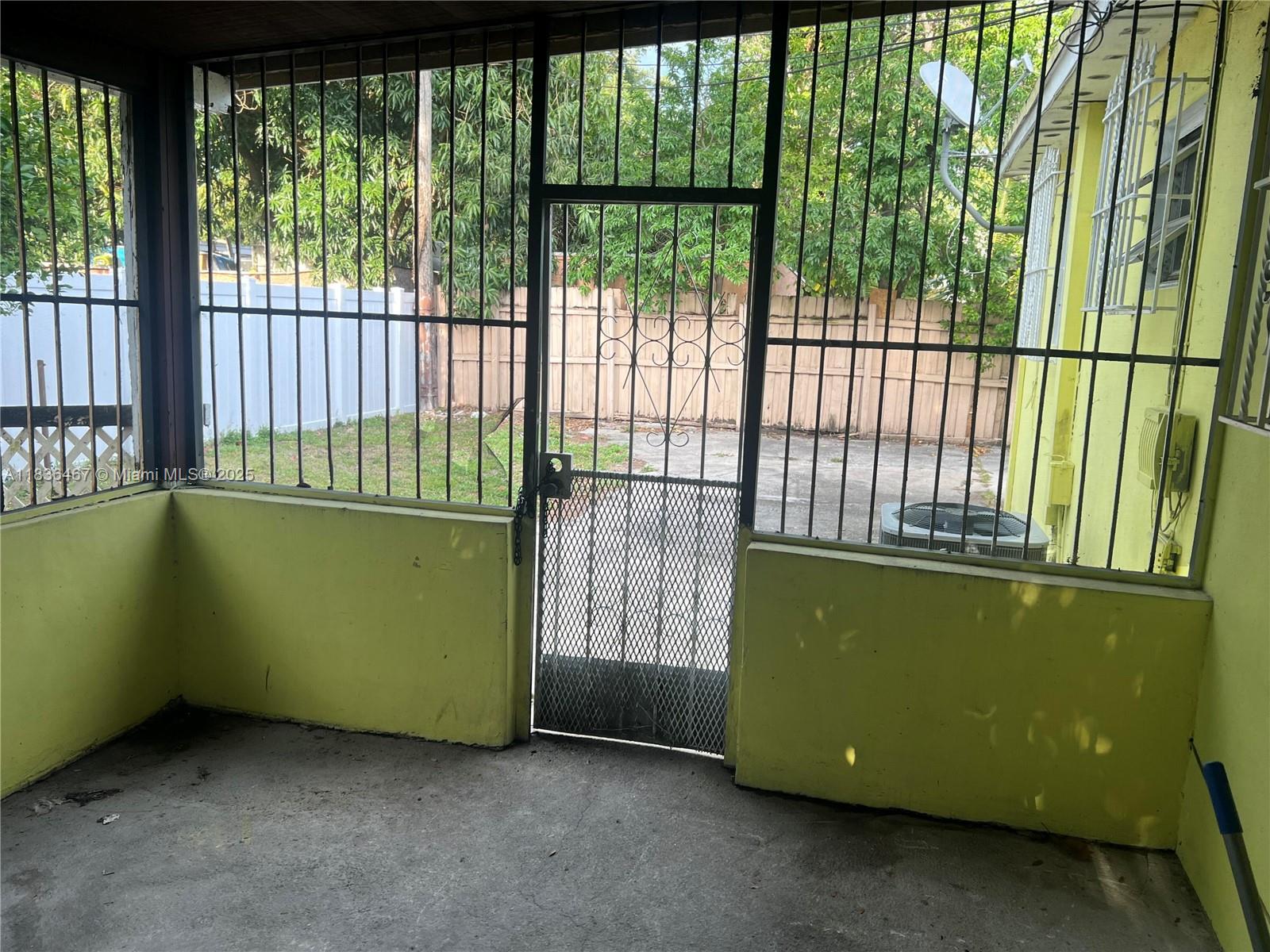 1825 Northwest 112th Street Miami, FL 33167 - Photo 20 of 24 a room with a green space and a large window