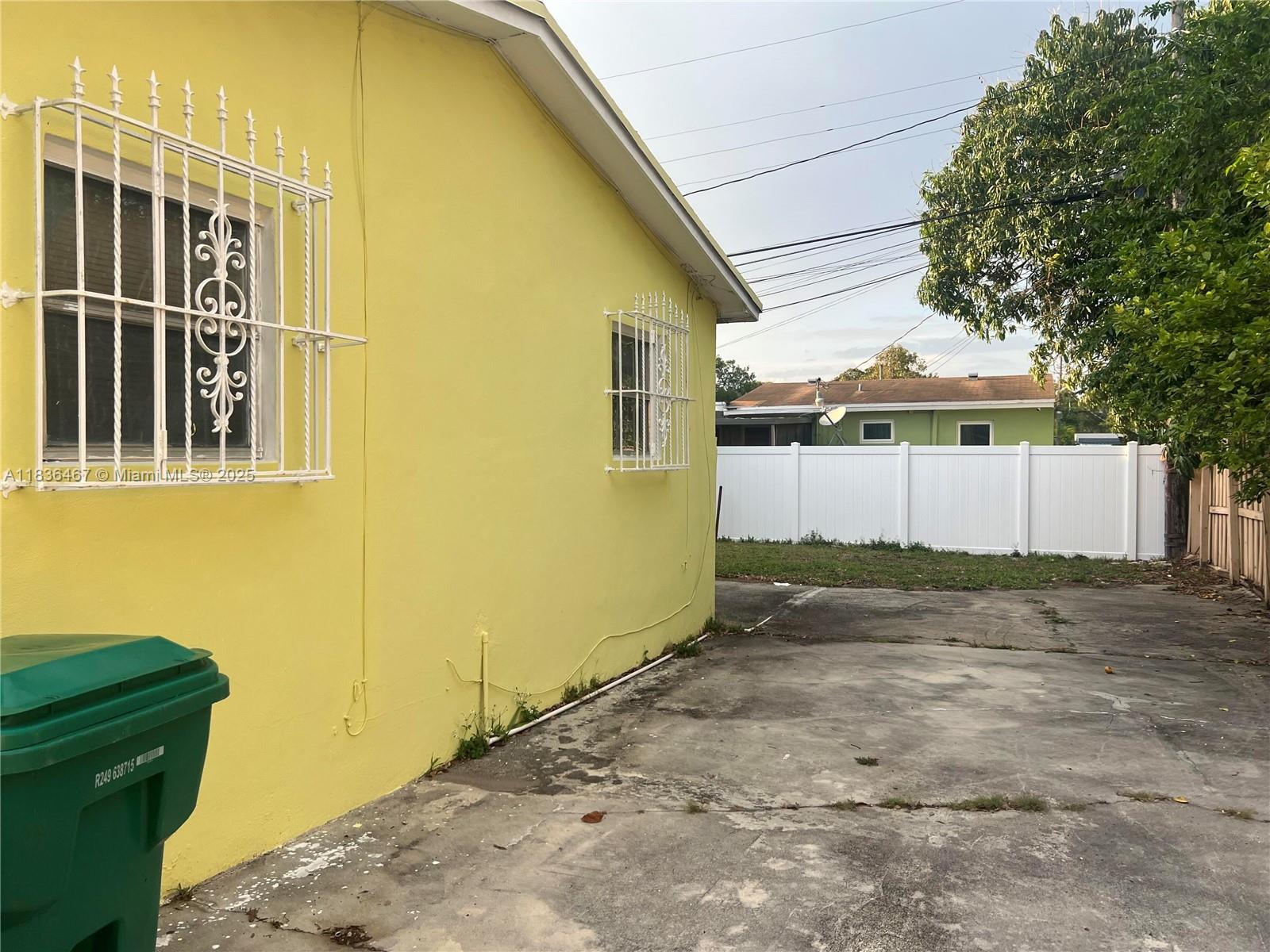 1825 Northwest 112th Street Miami, FL 33167 - Photo 22 of 24 a backyard of a house