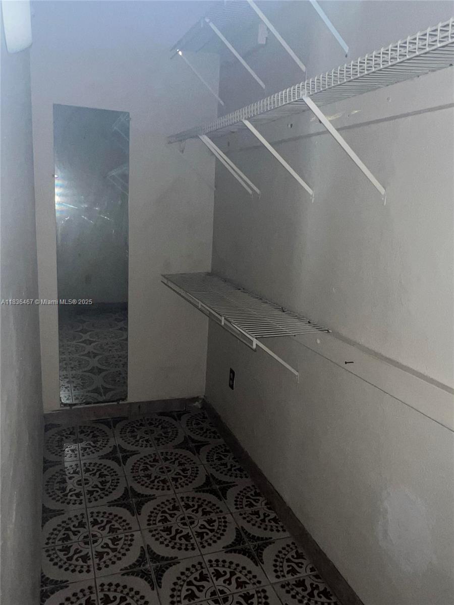 1825 Northwest 112th Street Miami, FL 33167 - Photo 23 of 24 a bathroom with a window