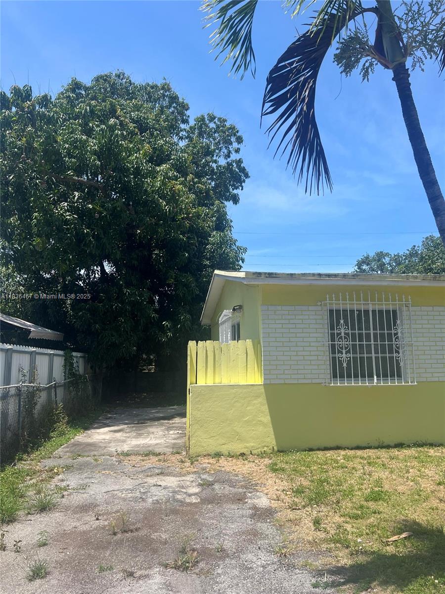 1825 Northwest 112th Street Miami, FL 33167 - Photo 3 of 24 a view of a house with a yard