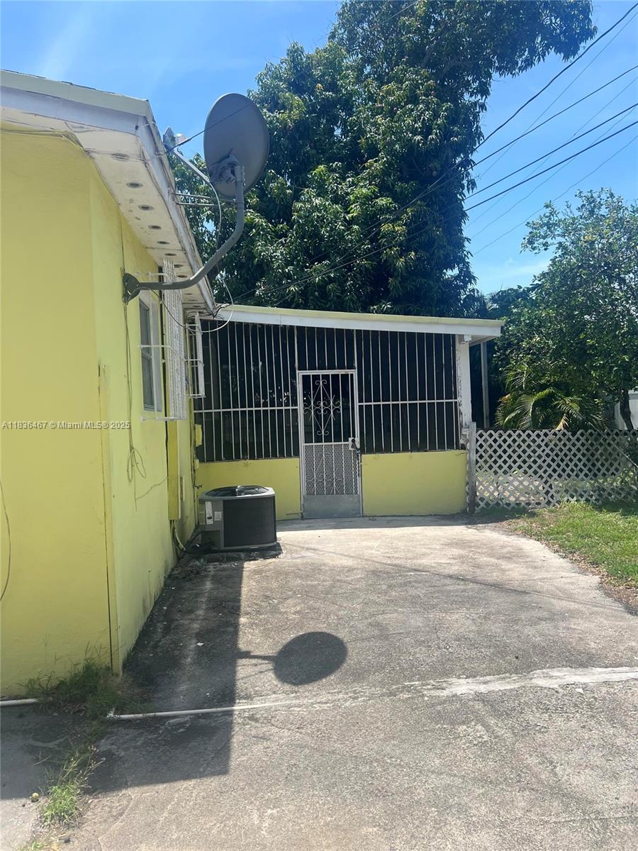 1825 Northwest 112th Street Miami, FL 33167 - Photo 4 of 24 a view of a porch with wooden floor