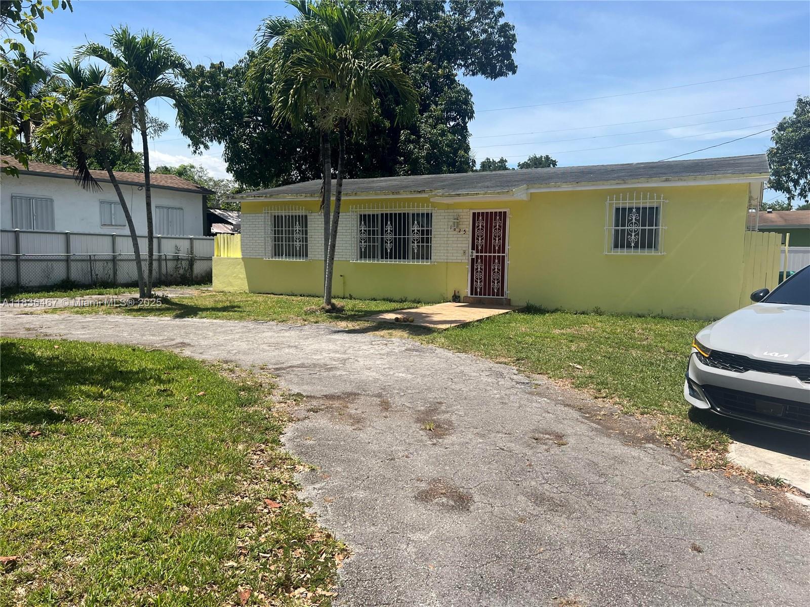 1825 Northwest 112th Street Miami, FL 33167 - Photo 8 of 24 a backyard of a house