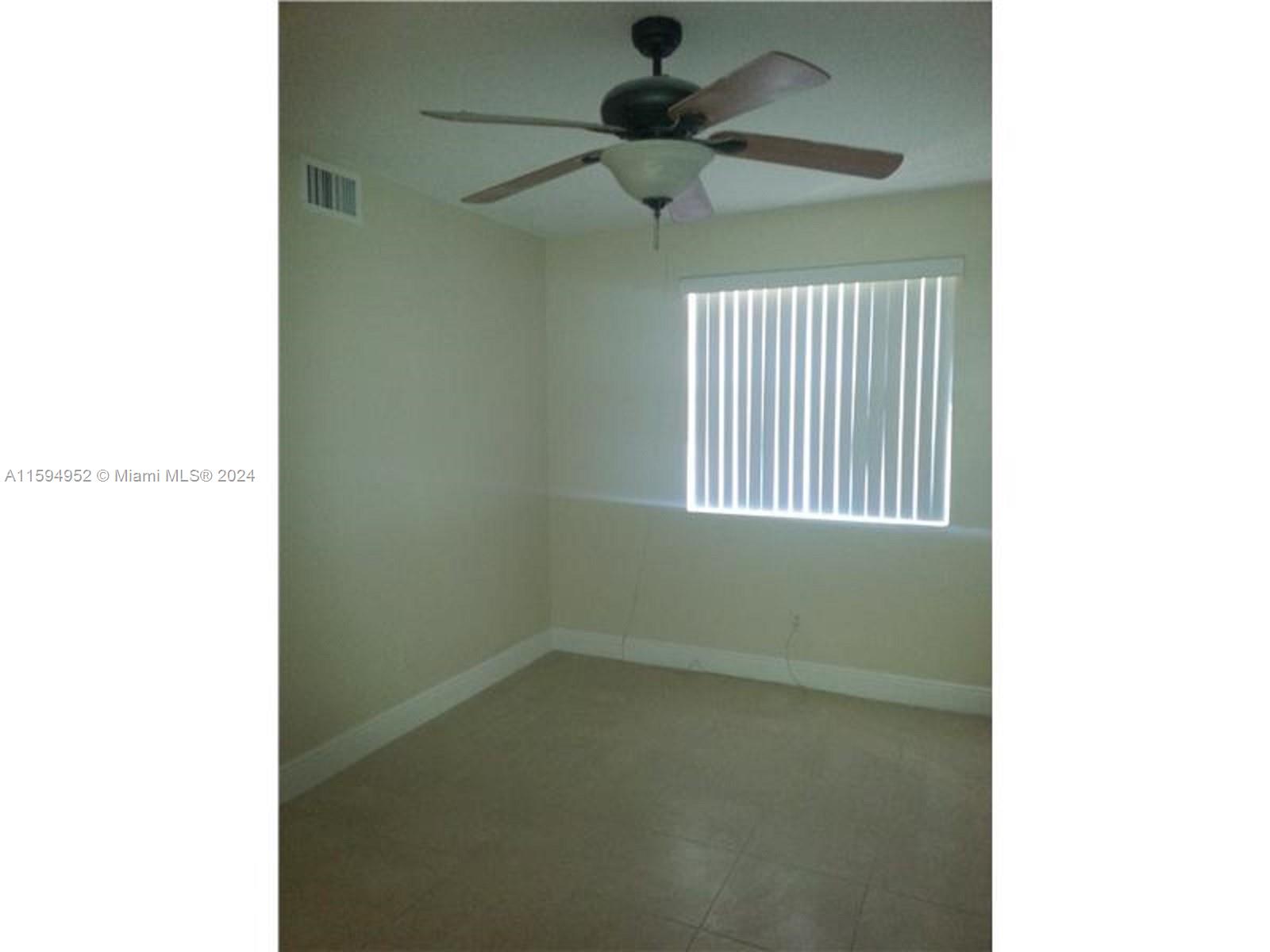 10024 Winding Lake Road, Unit 103 Sunrise, FL 33351 - Photo 2 of 6 Principal bedroom