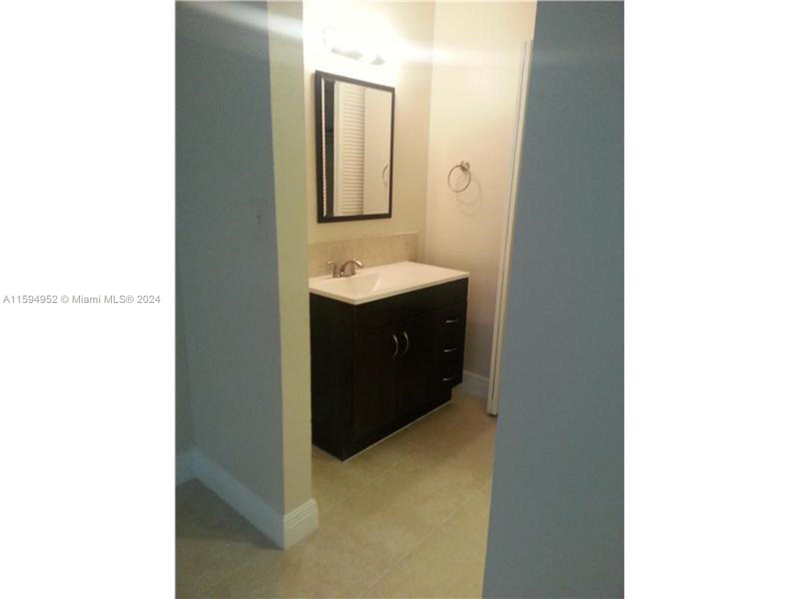 10024 Winding Lake Road, Unit 103 Sunrise, FL 33351 - Photo 3 of 6 Bathroom