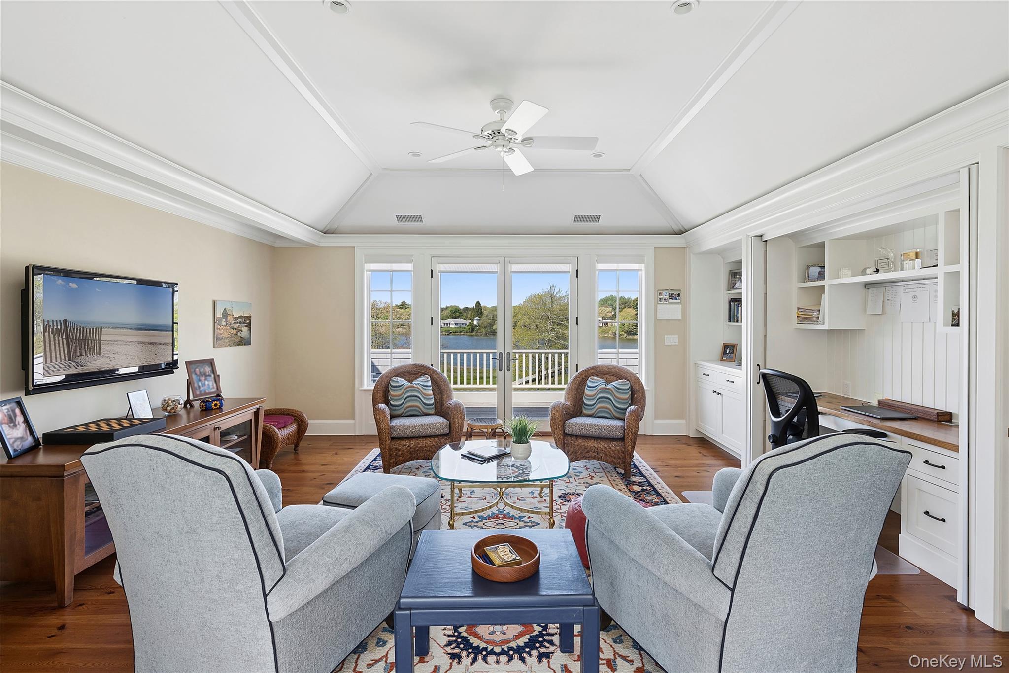 43 Old Main Road Quogue, NY 11959 - Photo 21 of 28 a living room with furniture and a flat screen tv