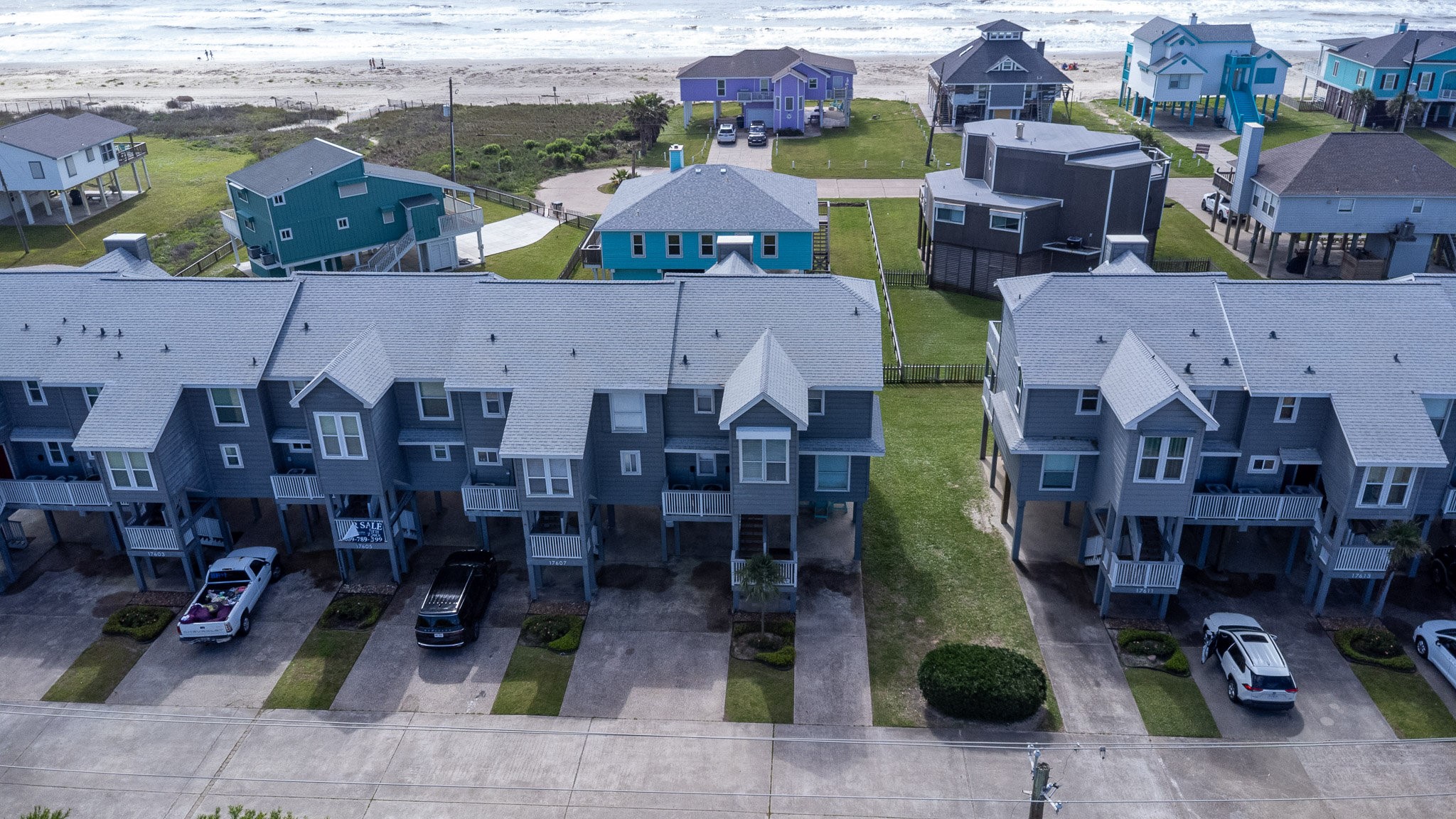 an aerial view of multiple houses with outdoor space