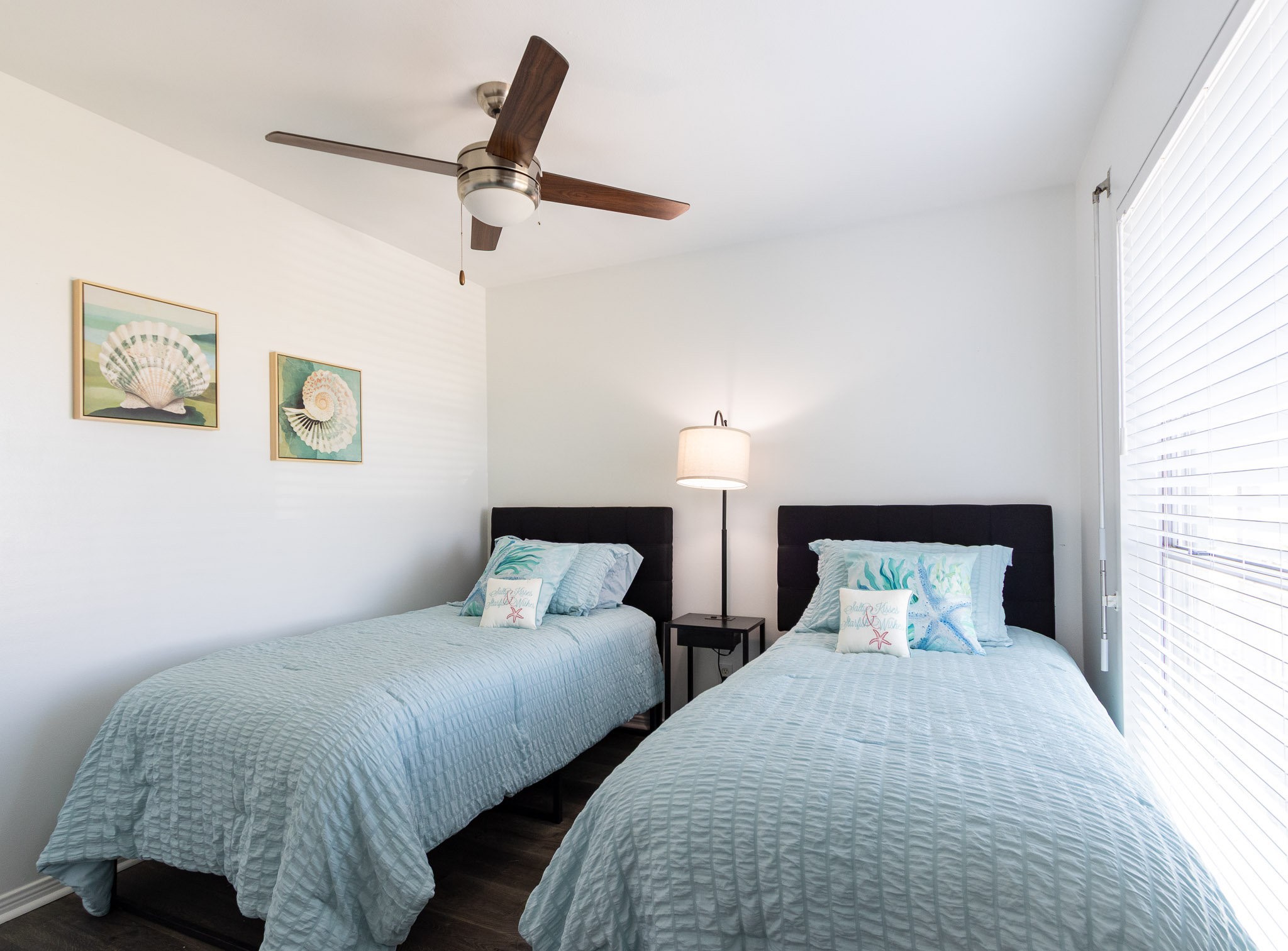 17609 Termini-San Luis Pass Road Galveston, TX 77554 - Photo 11 of 37 a bedroom with two beds and lamp
